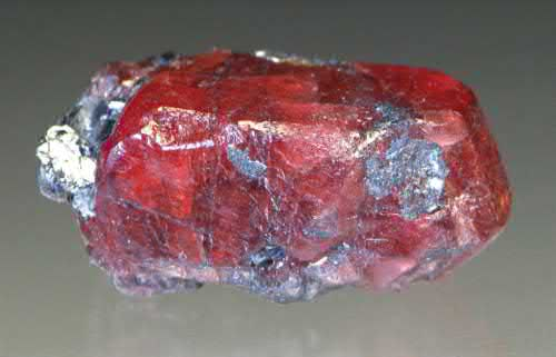 FIGURE 10. Rhodonite, Mn21SiO3, crystal about 1 cm in length,